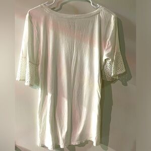 Classic white tee with eyelet short sleeves.